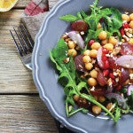 A plate of vegan buddha bowl salad. This recipe provides the body with proteins, carbohydrates, and many other nutrients.