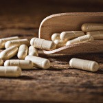 Selenium supplements on a wooden table. Selenium can come in several different forms and not all produce the same results.