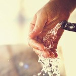 A man washing his hands. Water poses a huge threat to the thyroid function due to its toxic chemical content.