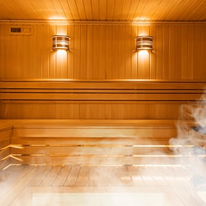 A sauna room. Saunas have many known benefits, from supporting your heart to flushing out fat-soluble chemicals and toxins.