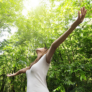 A woman walking in a park.