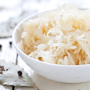 A bowl of sauerkraut. Bifidobacterium infantis strain helps break down sugar and fiber that can lead to bloating.