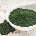 A bowl of blue green algae in a powder form. Organic blue-green algae is one of the most nutrient dense foods on the planet.