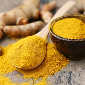 A spoon full of curcumin. Curcumin benefits include antioxidant support.