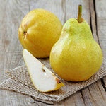 Two pears on a table. Pears are one of the ingredients of the delicious Goji berry recipe, Goji-Ginger Almond Pears.