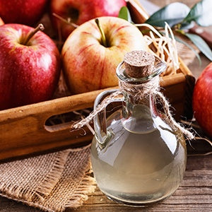 A bottle of apple cider vinegar. Probiotic supplements and apple cider vinegar are great for gut health.