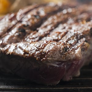 A grilled steak. There is a strong, well-documented relationship between the consumption of meat and cancer.