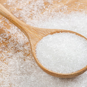 A spoon of MSG. Consuming monosodium glutamate can lead to high blood pressure and weight gain.