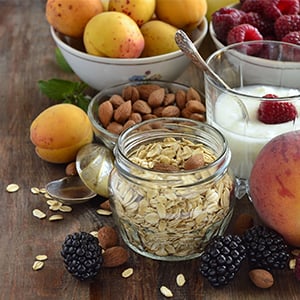 Table full of healthy foods that can be consumed as nutritional options to maintain mental health.