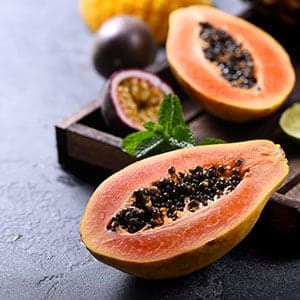 Papain enzymes can be found in papaya.