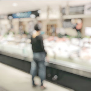 A man grocery shopping.