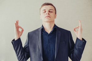 Picture of a man wearing dark blue clothing for stress relief due to the calming effect this color has on the body and mind.