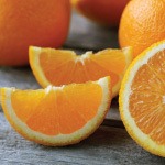 A table full of oranges. Hair loss can be a cause of anxiety, but there are vitamins and minerals that promote hair growth.