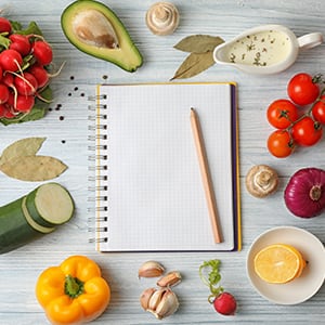 A pencil and a notepad. You can start a weight loss program by simply eating healthy and exercising regularly.