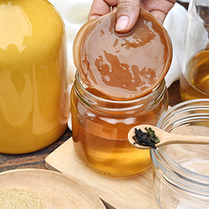 A glass of kombucha. Kombucha helps promote lung and liver health.