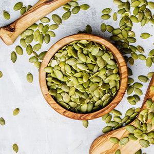 A bowl of pumpkin seeds.